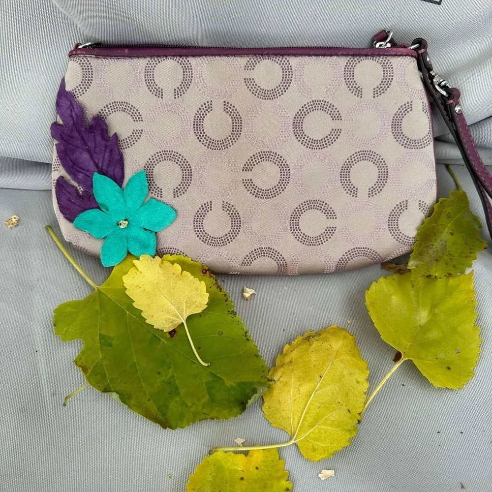 Coach Wristlet with suede flowers. Upstyled for a fresh new look. 9.25x5.5 x1”